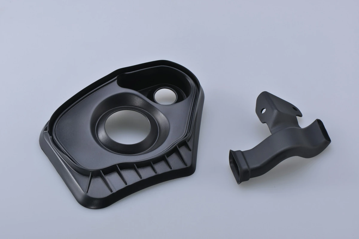 Engineered cover components with ribs and mounting features