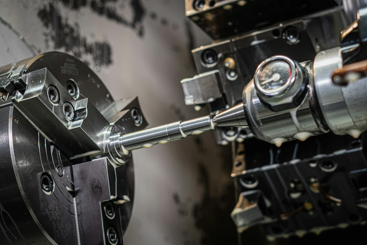 Lathe cutting a cylindrical workpiece