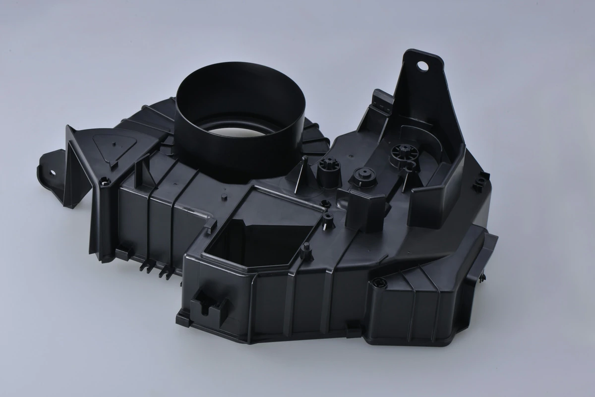 Molded housing with ribs and mounting features