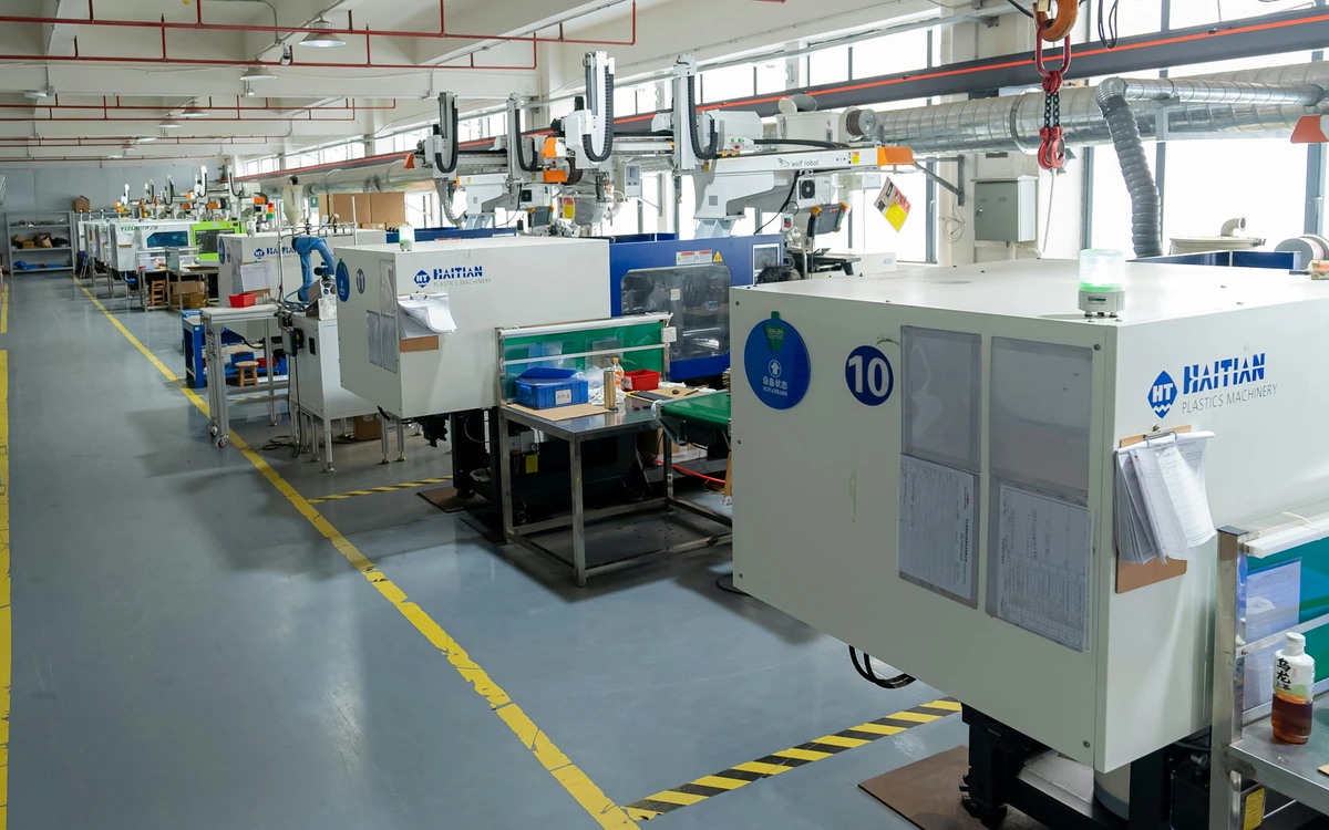Injection molding equipment on a production floor