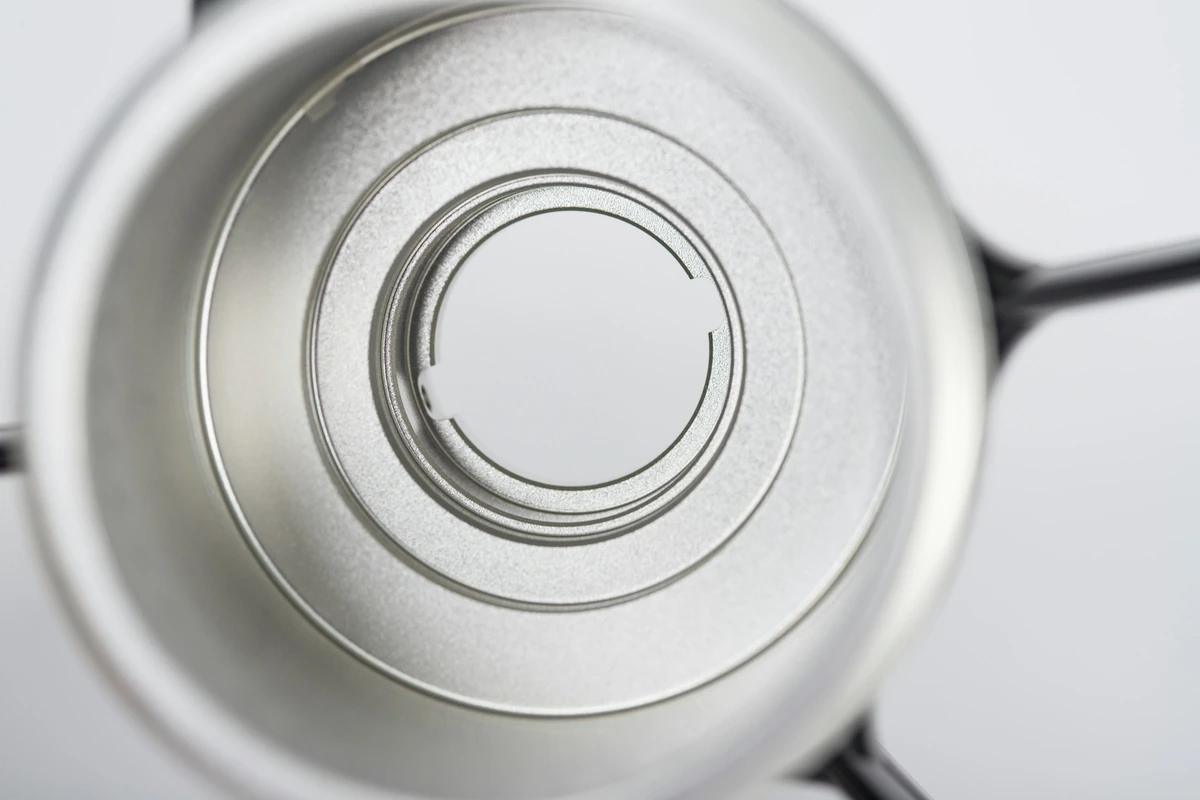 Metal housing with concentric machined features