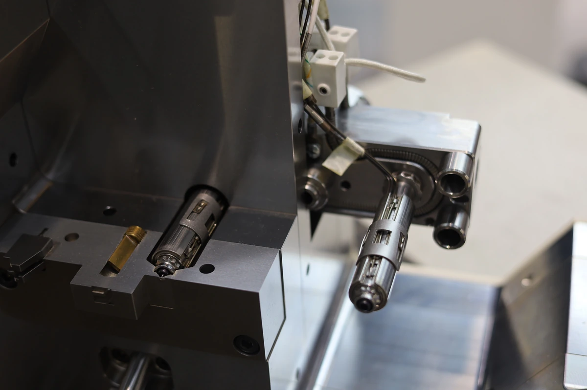 Steel injection mold with machined cavities and locating hardware