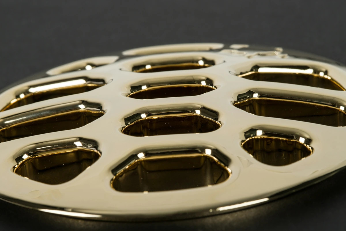 Polished metal component with machined openings