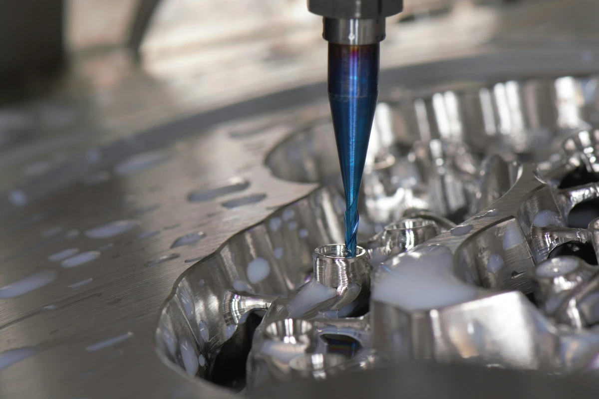 Cutting tool machining shaped metal features