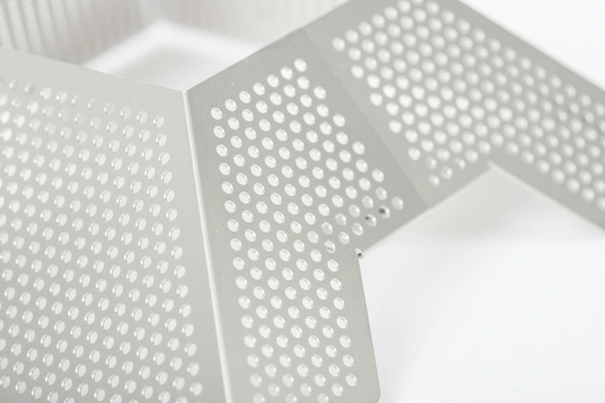 Perforated metal panels with formed edges