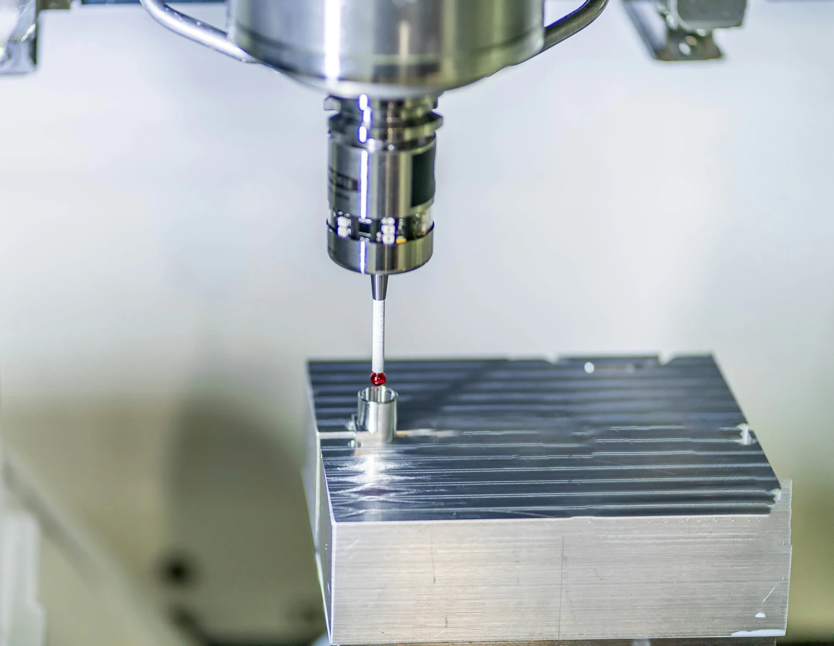 Machining probe checking a metal workpiece